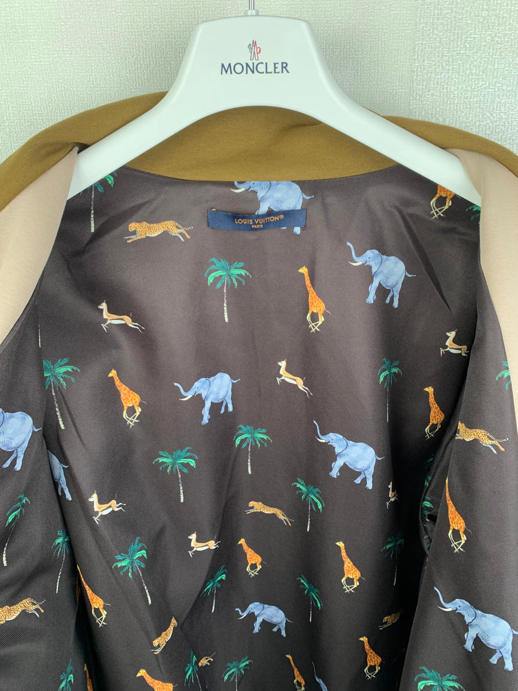 Long Louis Vuitton top with dark background and colorful animal pattern