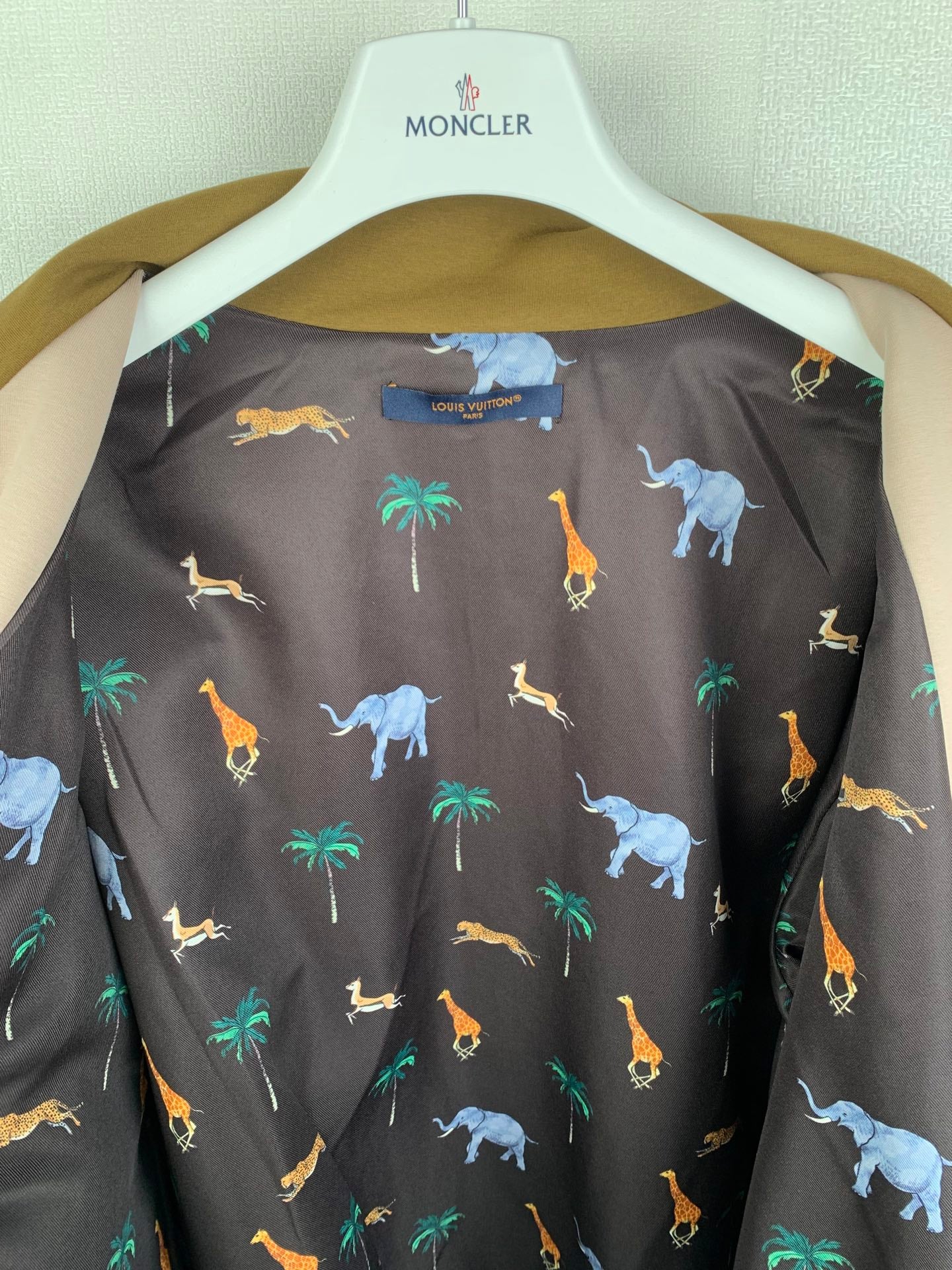 Long Louis Vuitton top with dark background and colorful animal pattern