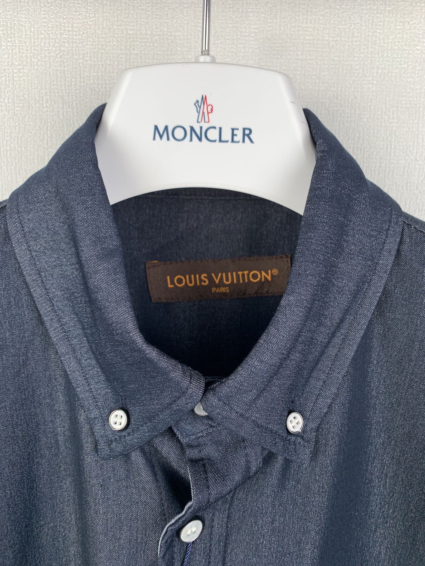 Dark blue shirt neckline and two-button collar, with inner label at chest