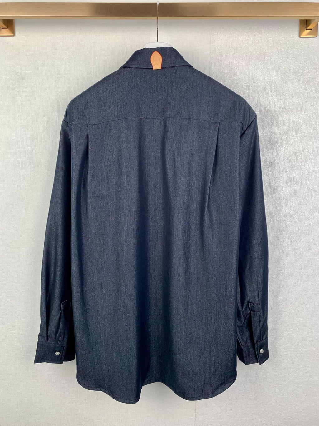 Dark blue long-sleeve button-up shirt, back view