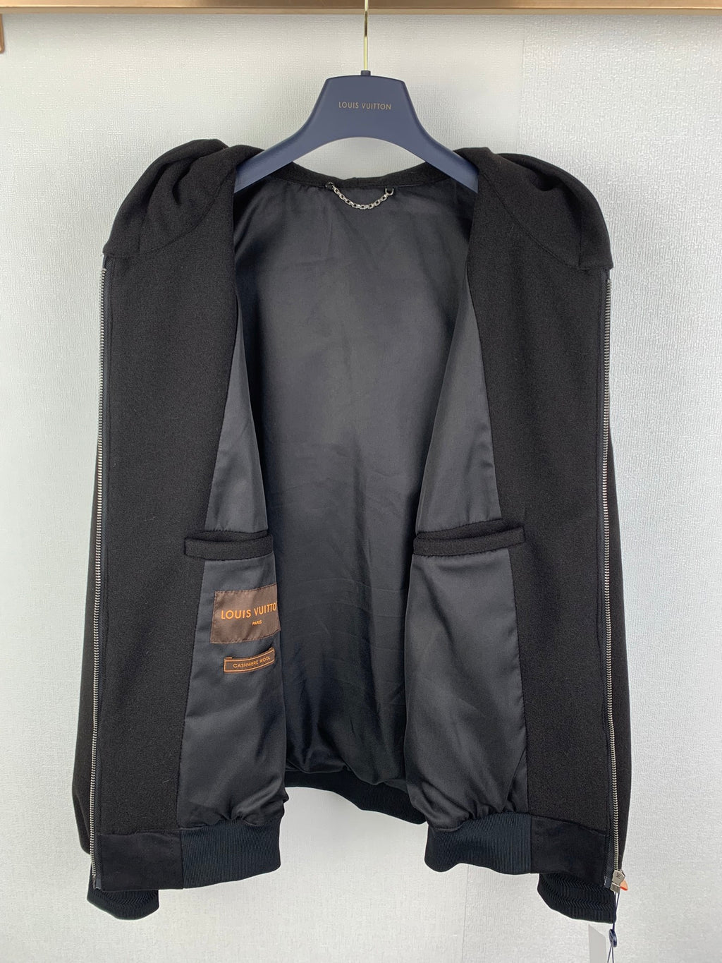 Louis Vuitton long coat, dark with exposed inner pockets and snap buttons