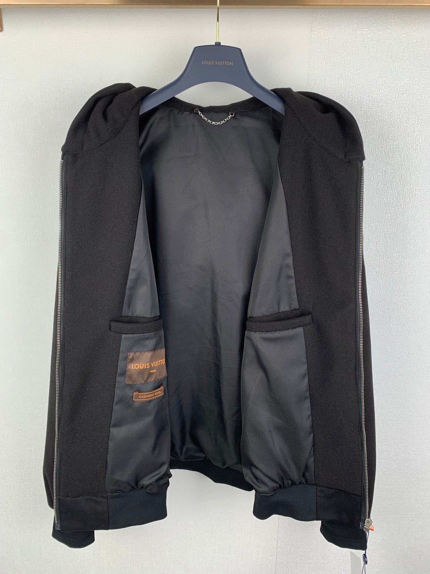 Louis Vuitton long coat, dark with exposed inner pockets and snap buttons