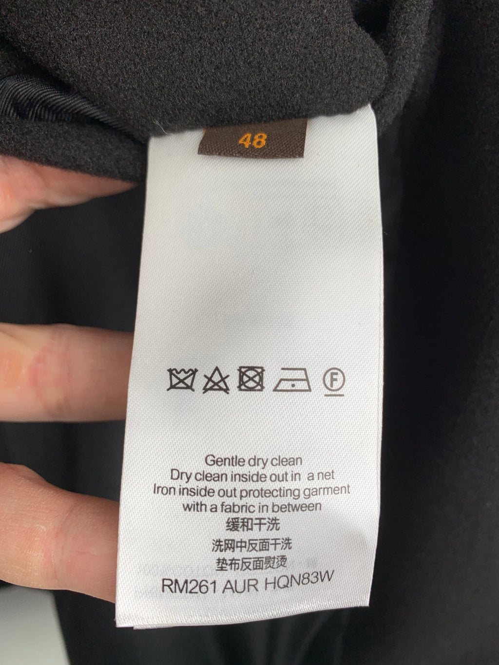 Louis Vuitton long coat size tag 48 with care symbols and fabric instructions