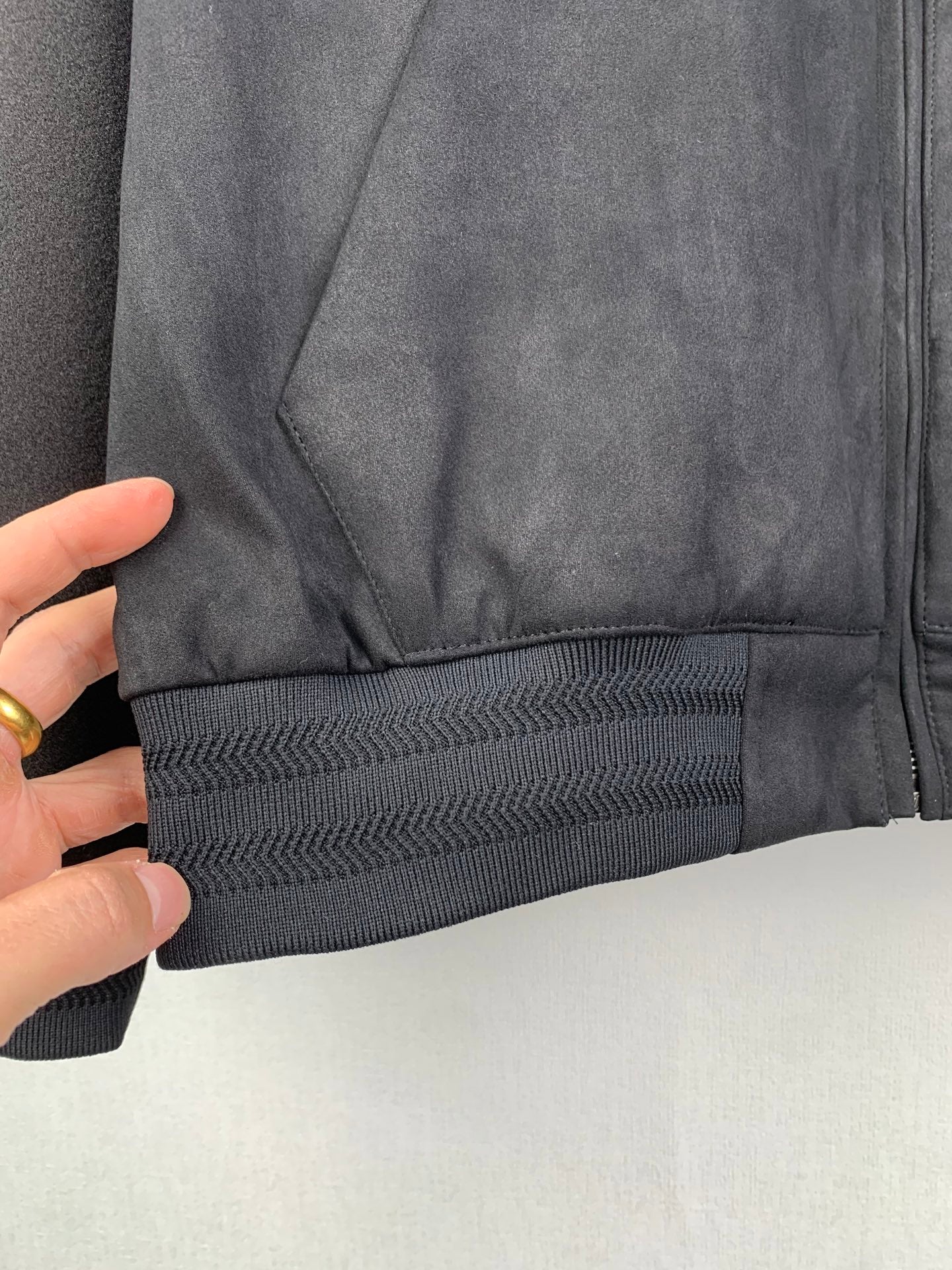 Louis Vuitton hooded zip-up jacket, dark gray, close-up of elastic hem band