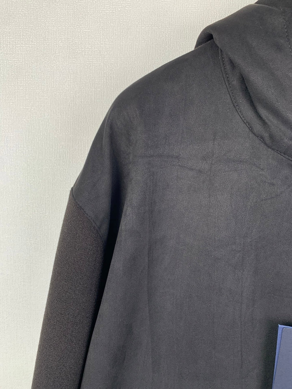 Louis Vuitton hooded zip-up jacket, dark gray, close-up of sleeve and shoulder