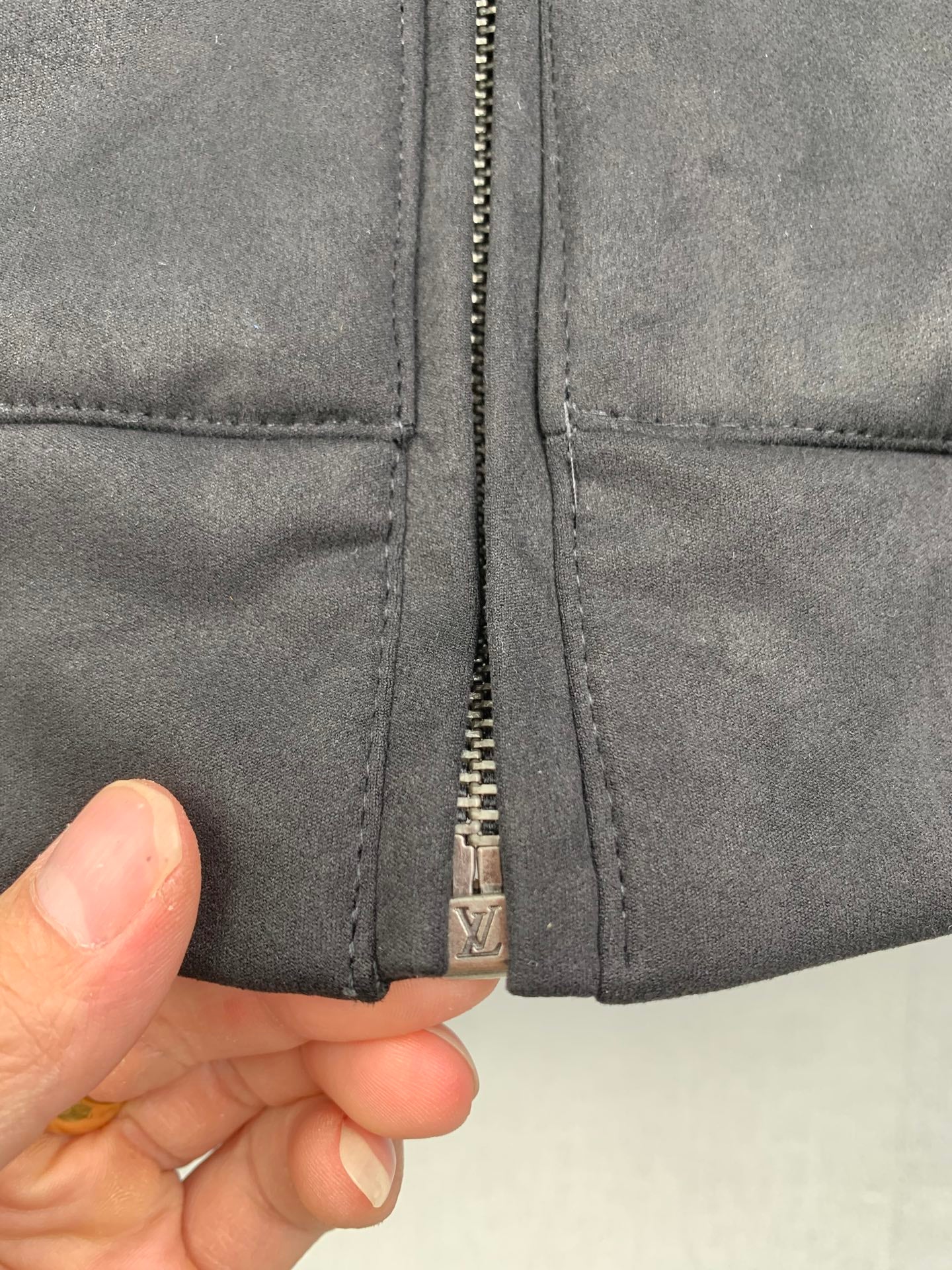 Louis Vuitton hooded zip-up jacket, dark gray, close-up of front zipper