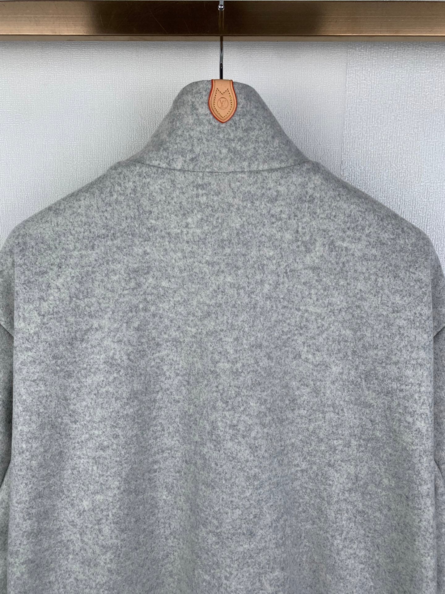 Grey zip-up jacket with stand collar, back view detail