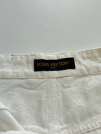 Beige pants waistband with black Louis Vuitton Paris label