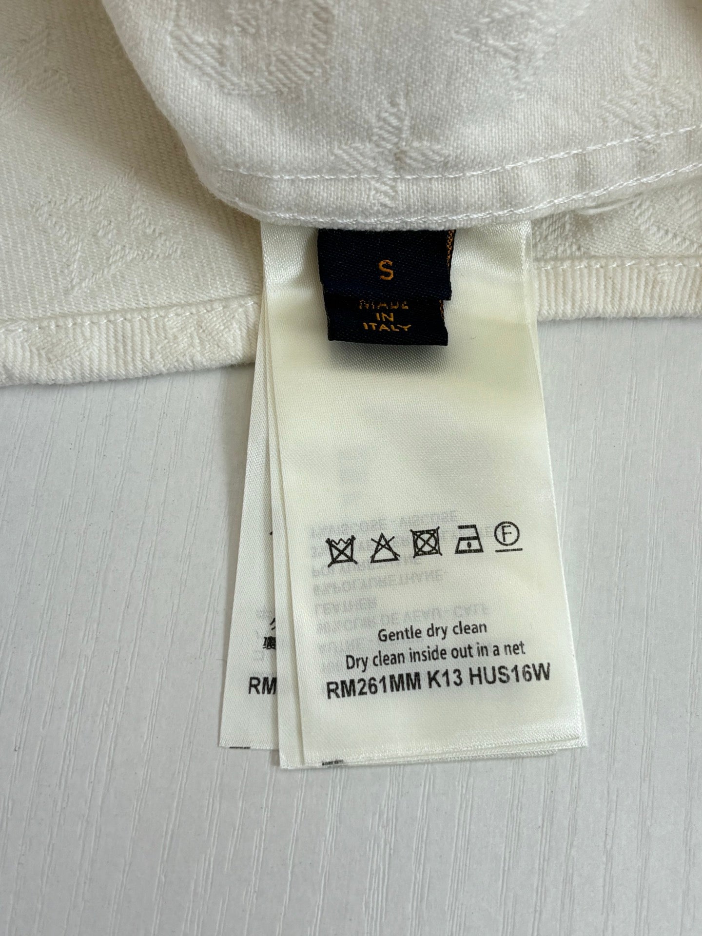 Louis Vuitton shorts, white fabric with care label tag at waistband