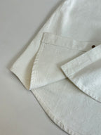 Louis Vuitton white shirt sleeve and hem detail with stitched seam