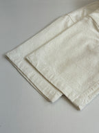 Louis Vuitton white short-sleeve shirt hem and fold detail, textured fabric