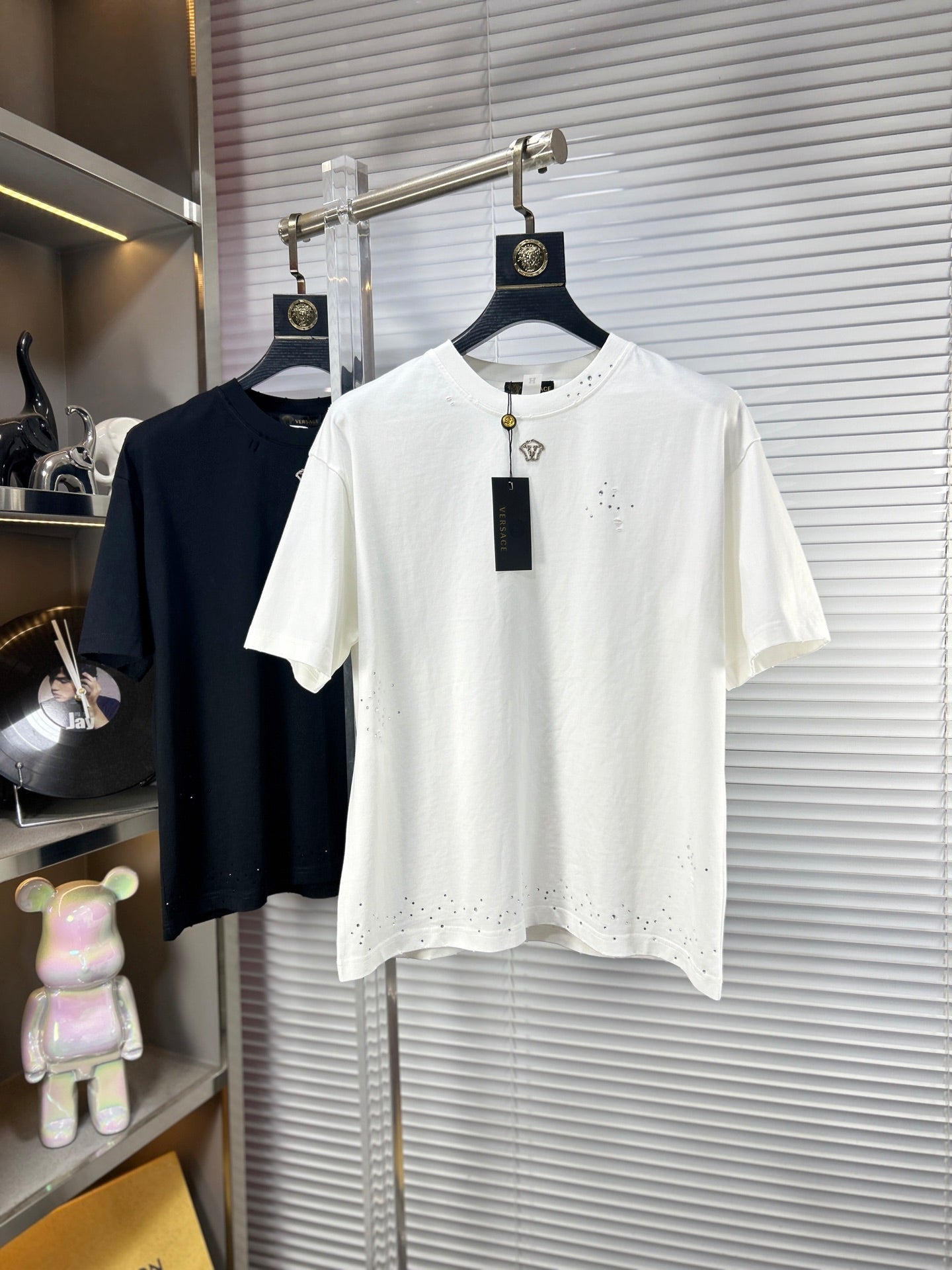 Versace white T-shirt with rhinestone logo at chest and small studded detail