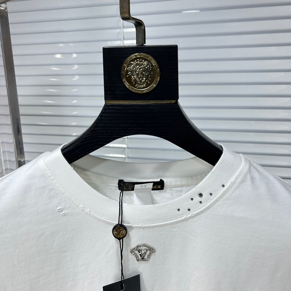 Versace white T-shirt neckline with hanging tag and rhinestone logo on chest