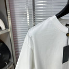 Versace white T-shirt sleeve and upper back with small stud marks