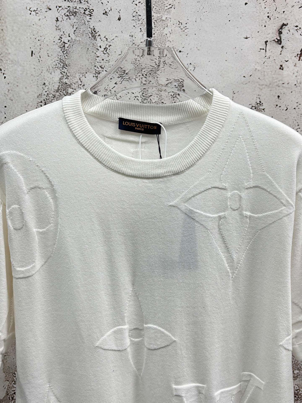 White crewneck T-shirt with allover line icon print, upper front close-up