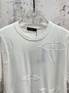 White crewneck T-shirt with allover line icon print, upper front close-up