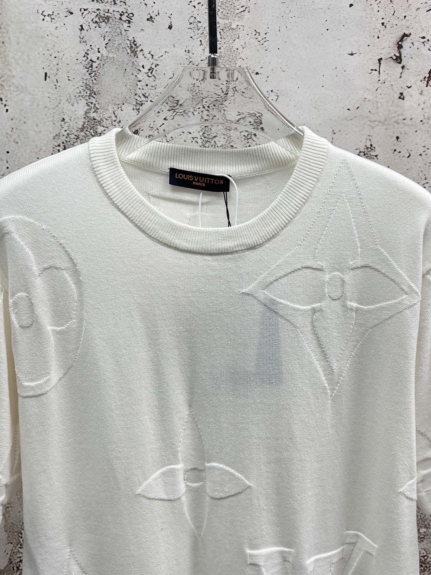 White crewneck T-shirt with allover line icon print, upper front close-up