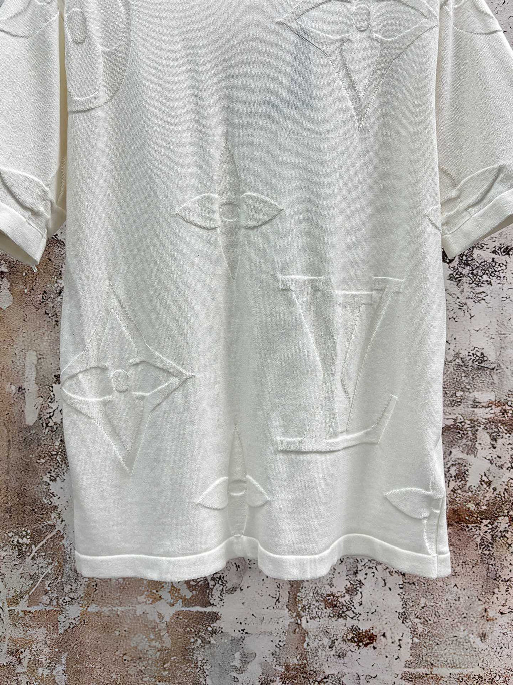 White crewneck T-shirt with allover line icon print, close-up of front