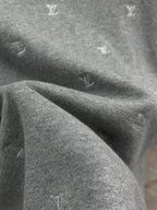 Grey monogram knit fabric fold detail on T-shirt