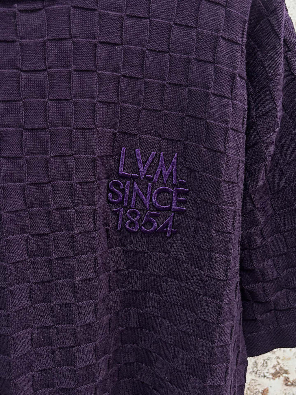 Purple textured knit T-shirt close-up of LV Since 1854 embroidered chest logo
