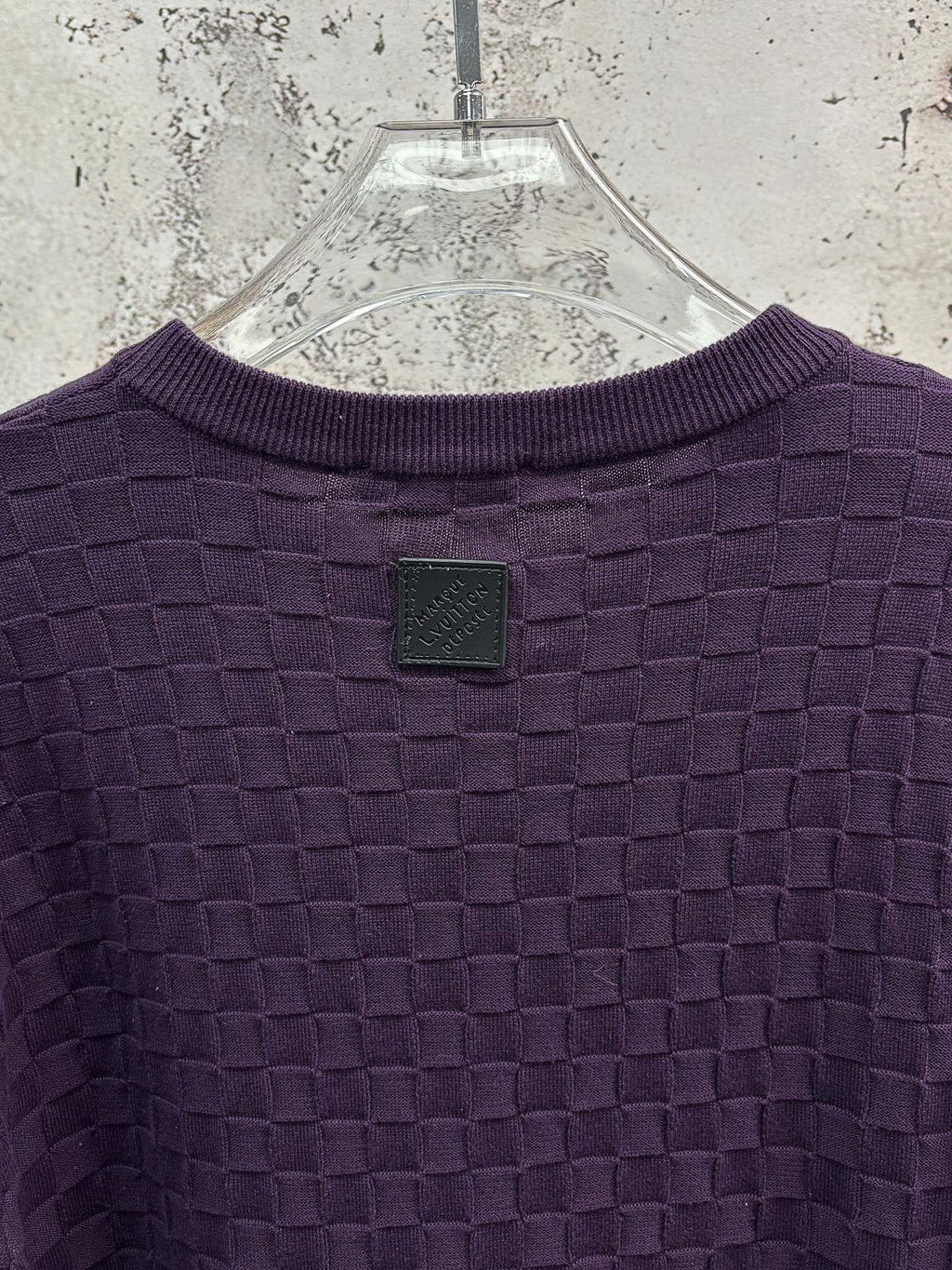 Purple textured knit T-shirt, back with small square patch near neckline