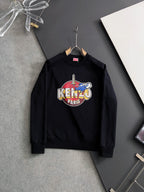 Black sweatshirt with colorful "KENZO PARIS" graphic on the chest