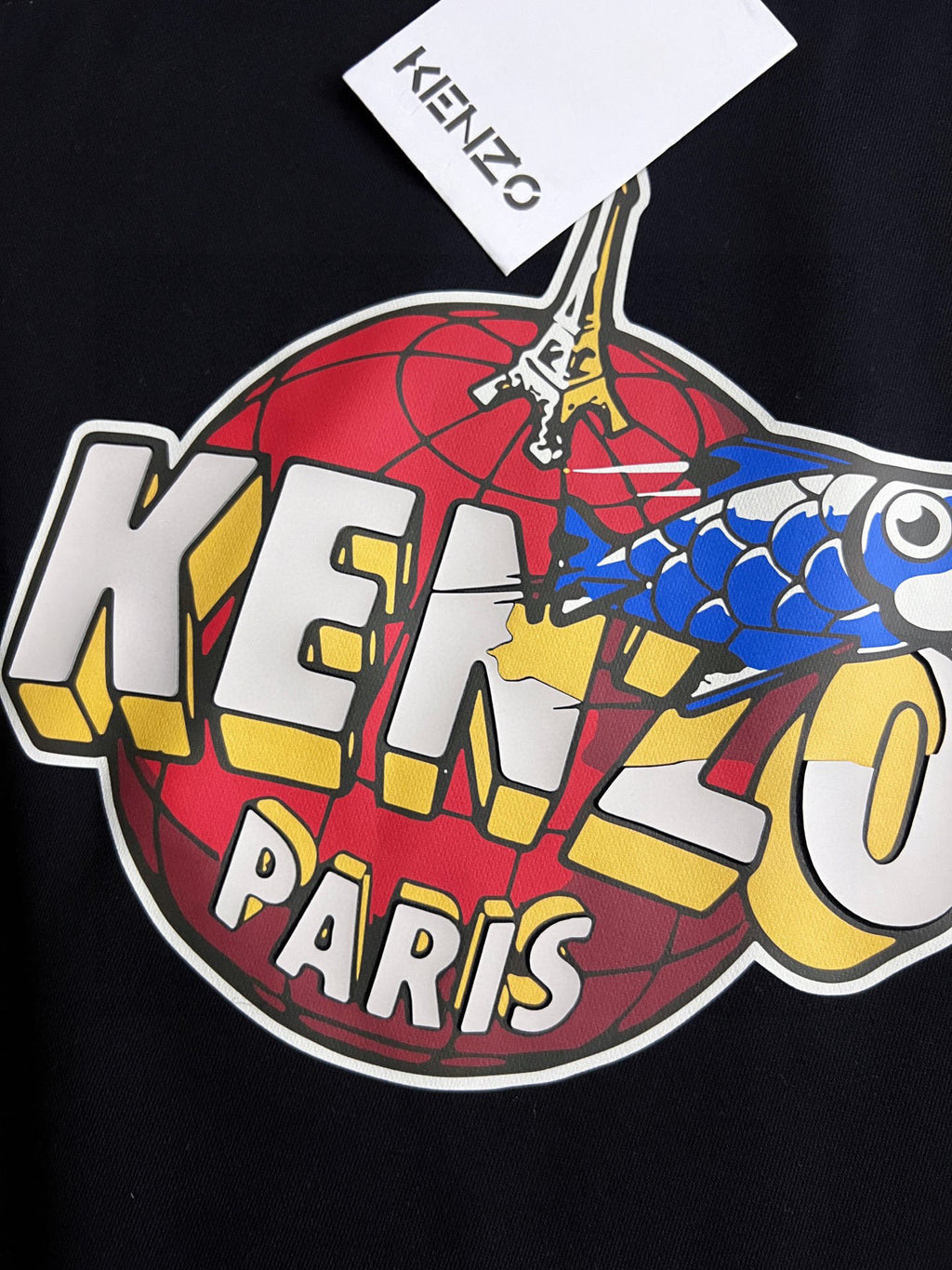 Black sweatshirt close-up of colorful "KENZO PARIS" front graphic