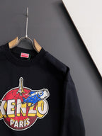 Black sweatshirt with large "KENZO" and "PARIS" graphic across the front