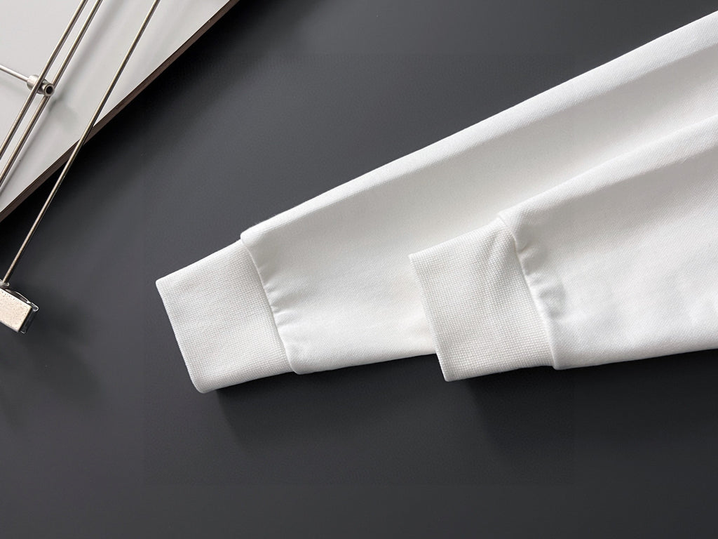 White sweatshirt sleeve and ribbed cuff detail