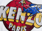 Close-up of Kenzo Paris graphic on white sweatshirt, red blue and yellow print