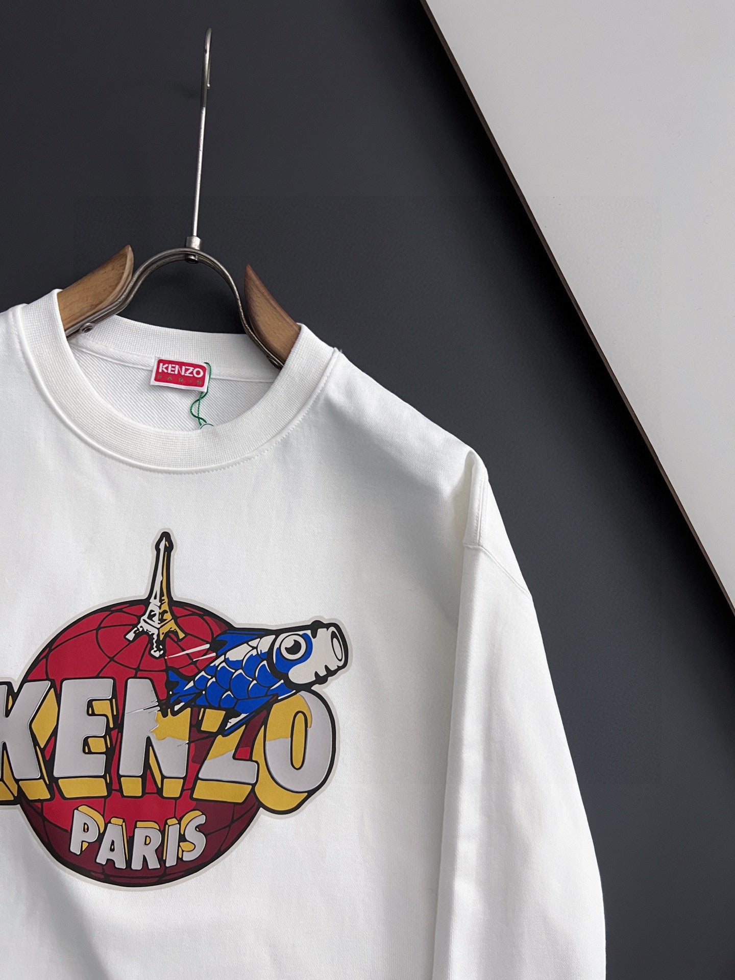 White sweatshirt with large Kenzo Paris graphic on the front, crew neckline