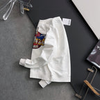 White sweatshirt folded for display with front Kenzo Paris graphic partially visible