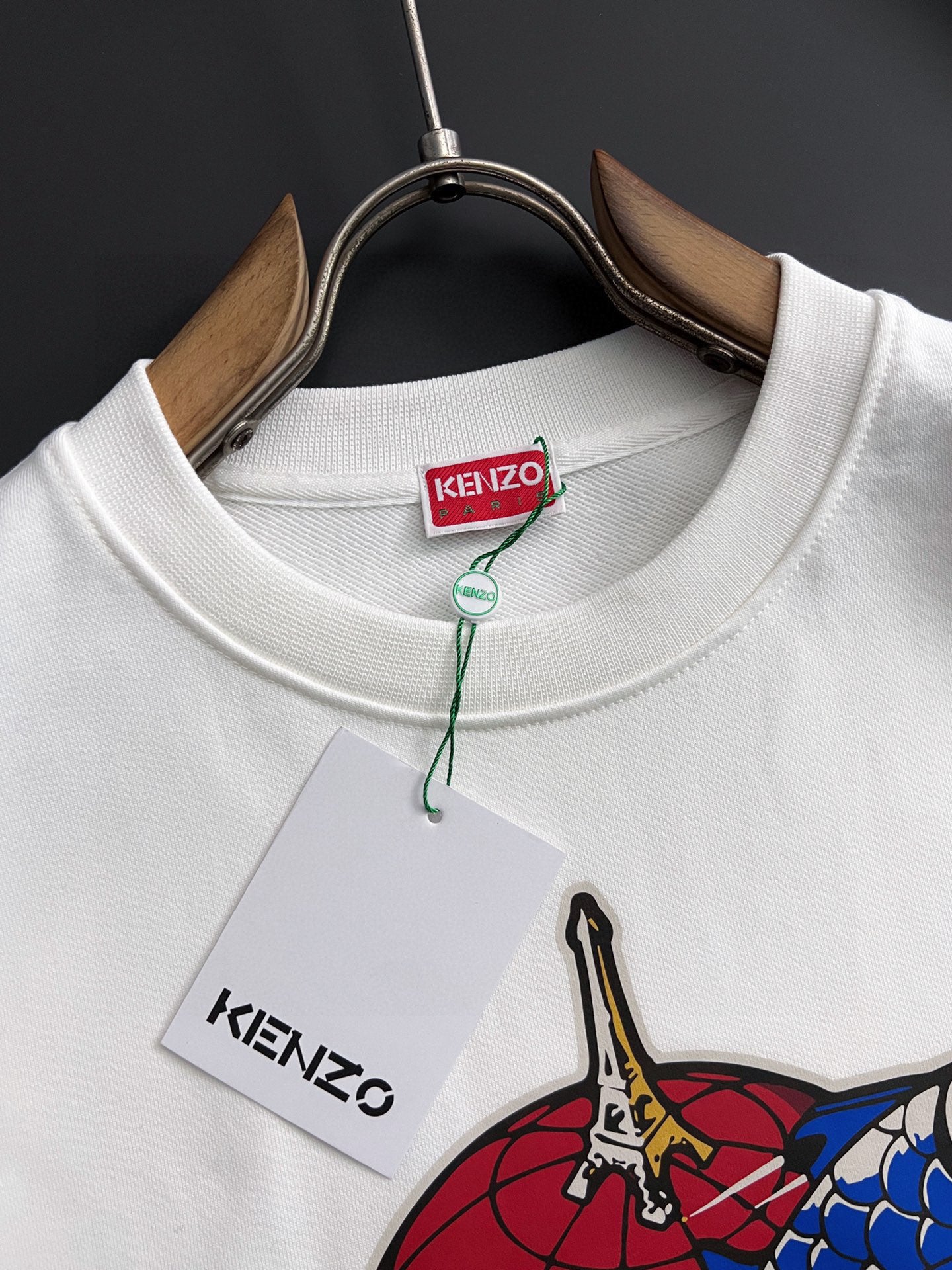White sweatshirt crew neck with Kenzo neck tag and partial multicolor graphic