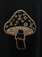 Gold embroidered mushroom emblem on black T-shirt front