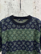 Crewneck short-sleeve shirt close-up of navy monogram pattern across chest