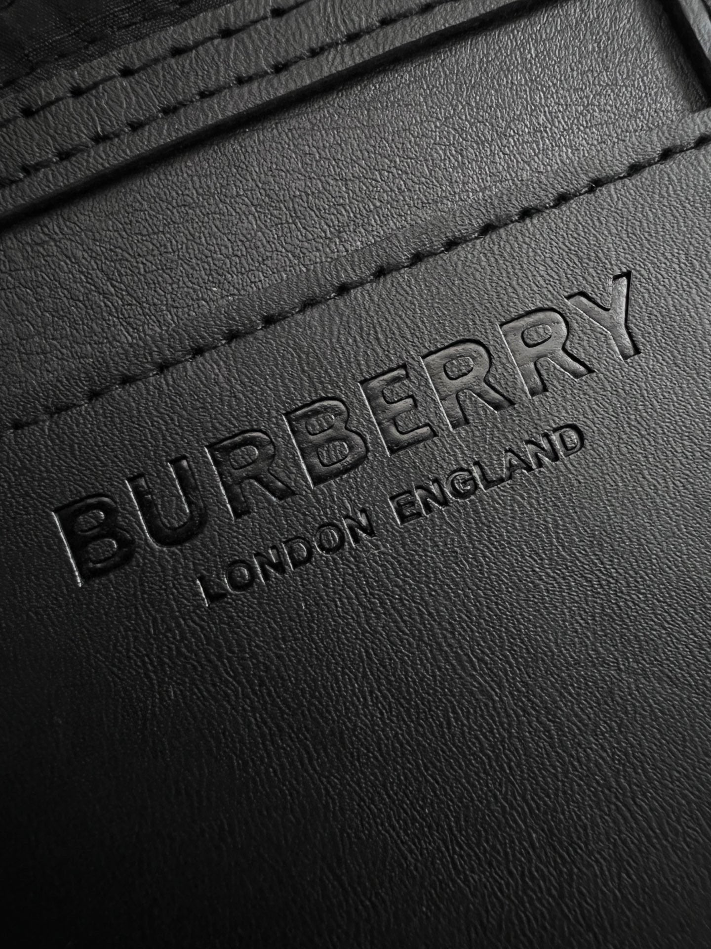 Burberry embossed logo on black leather patch
