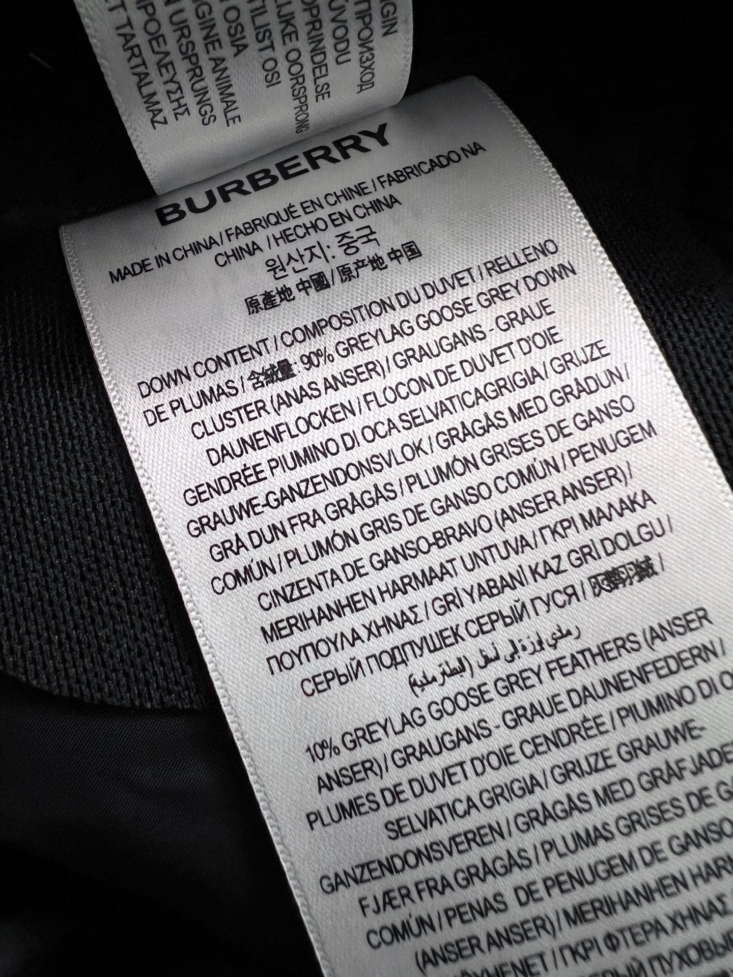 Burberry care label on inside waistband showing fabric composition and care instructions