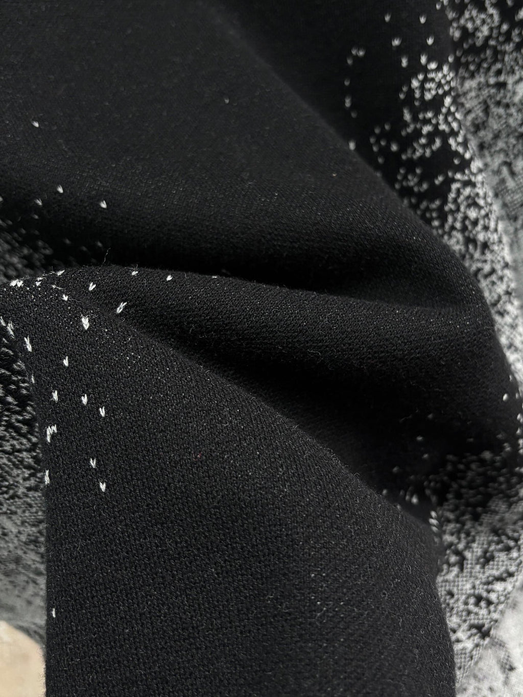 Louis Vuitton black knit fabric with fine white speckles and soft drape