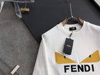 White long-sleeve sweatshirt with yellow V logo detail and FENDI lettering, hang tag