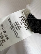 White sweatshirt fabric close-up with printed care and size label text