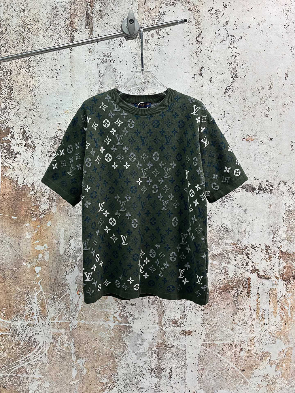 Louis Vuitton monogram T-shirt in dark green with scattered blue-and-white logos