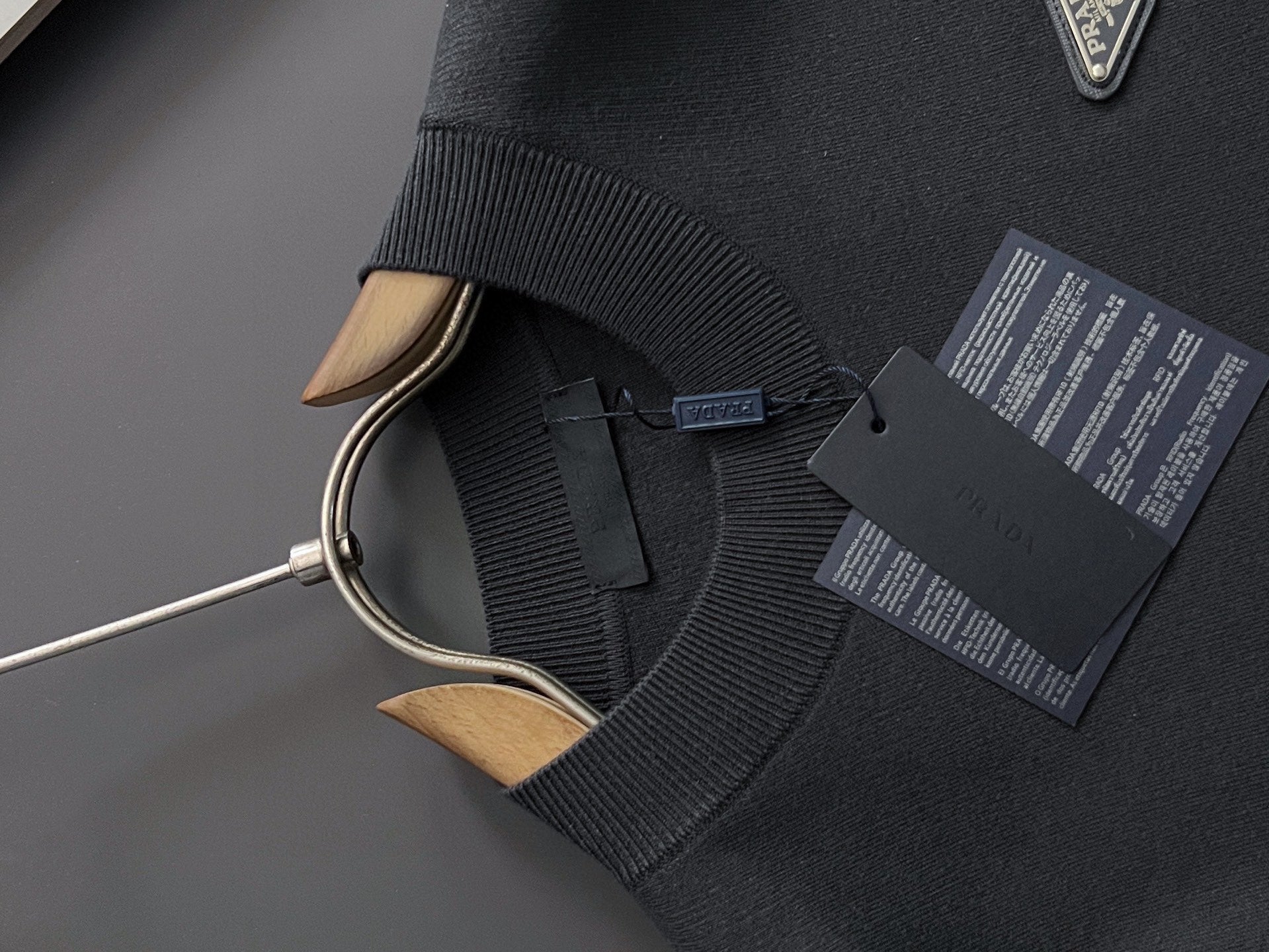 Prada long-sleeve top, black, ribbed collar and cuffs, hanging product tags