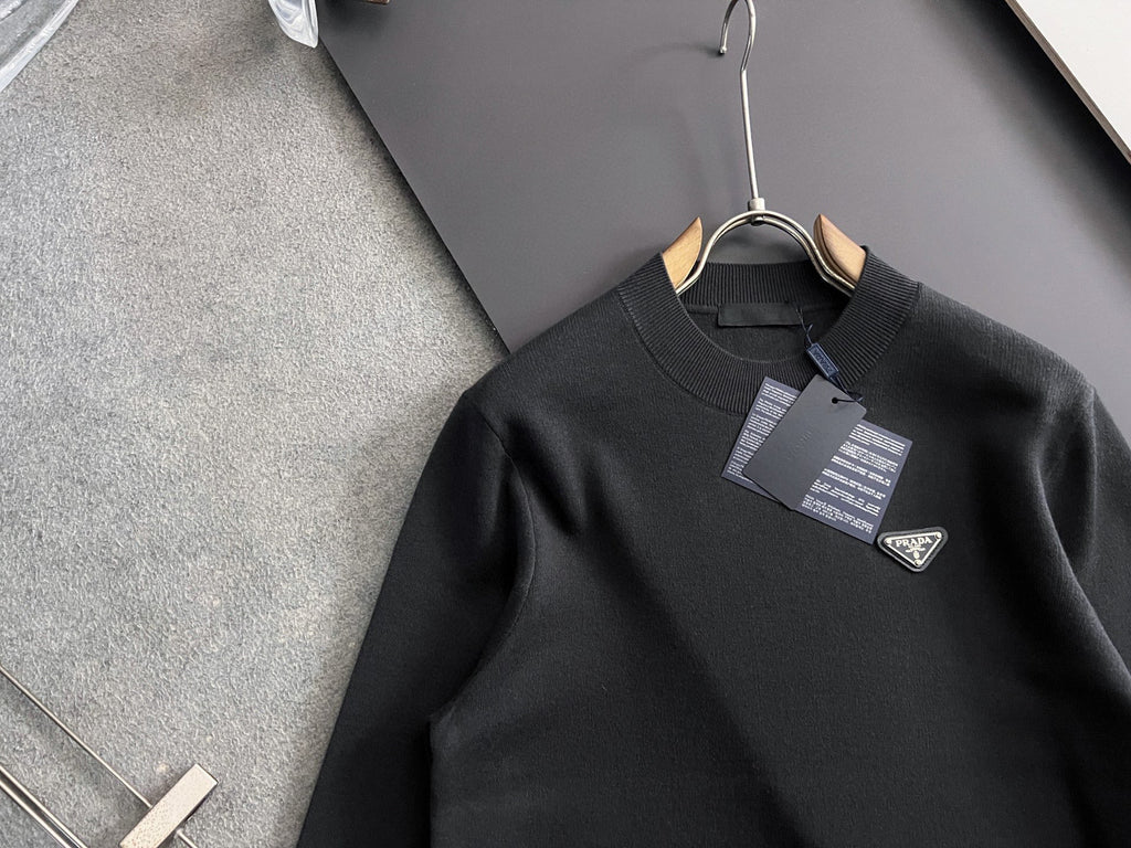 Prada long-sleeve top on hanger, black, ribbed crew neck, triangle logo and tags