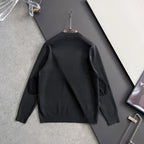 Prada long-sleeve top, black, on hanger, ribbed crew neck and triangle logo badge