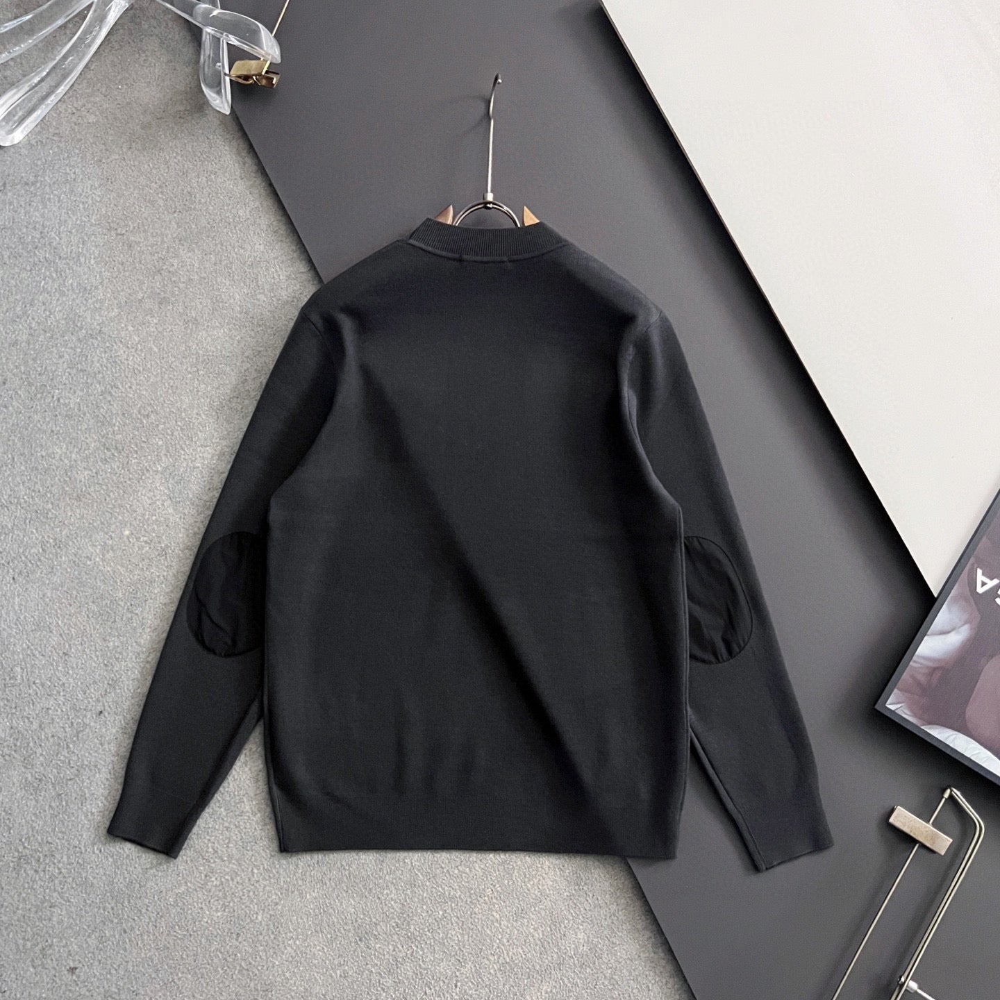 Prada long-sleeve top, black, on hanger, ribbed crew neck and triangle logo badge
