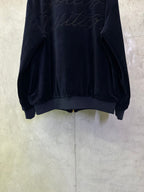 Dark navy zip-up jacket back view with ribbed hem and cuffs