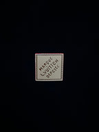 Garment label patch reading "Marque Vuitton" and "Depute"