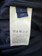Clothing care label with "Dry clean only" and protectant symbols on fabric tag