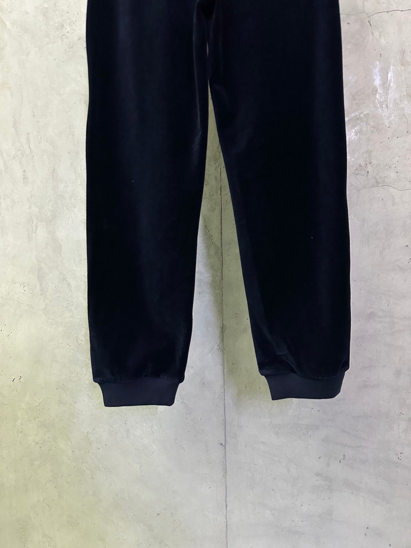 Navy straight-leg pants with elastic hem at the ankles