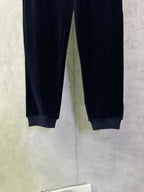 Navy straight-leg pants with elastic cuffs